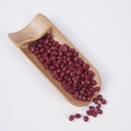 Detailed view of dark red artificial grain wax beads in a bamboo scoop for DIY crafts - Small Red Chestnuts (500g)