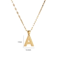 Close-up of golden letter A pendant showing 17mm height and 14.5mm width dimensions - Letter A