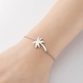 Silver stainless steel chain bracelet with hollow coconut tree pendant on a wrist - Coconut Tree Steel Color