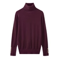 Detail of burgundy turtleneck sweater featuring gold buttons on long sleeve cuffs - Burgundy