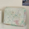 Detailed macro view of quilted watercolor makeup bag with soft pastel tie-dye pattern - Watercolor Smudge [Handbag]