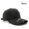 Black distressed baseball cap with embroidered lettering and washed vintage cotton finish - Black