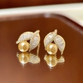 Elegant gold leaf earrings with sparkling zircons and a large golden pearl drop - Pearl Leaf Studs / Gold Brown
