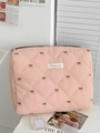 Pink quilted makeup bag with brown bow embroidery and Purered brand label details - Strawberry Bow Handheld Bag