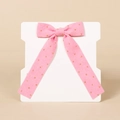 Close-up of pink corduroy bow hair clip with gold polka dots on white display card - Hot Pink