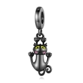 Detailed view of a black metal cat charm with green eyes and a polished finish - CCT247-Cute Stylized Black Cat