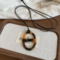 Close-up of tortoise shell resin link necklace on a vintage wooden tray and linen cloth - 40# Necklace - Brown-Pig Nose