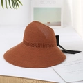 Brown knit sun hat featuring an openwork design and a large black ribbon bow accent - Adjustable / Caramel color