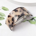 U-shaped tortoise shell acetate hair claw clip with leopard pattern on white surface - Light Coffee