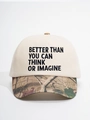 Detail of baseball cap with cream crown and camo brim featuring embroidered BETTER THAN text - Off-white and Camo