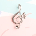Silver treble clef brooch with white rhinestones and a teardrop crystal on top - Silver & White (Style 2)
