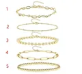 Five-piece layered golden bracelet set featuring Cuban links, beads, and paperclip chains - Gold Set - Multiple Popular Chain Designs