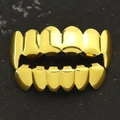 Polished gold-plated hip hop teeth grillz set featuring top and bottom six tooth rows - Fang and Flat Tooth Combo / Top Fangs Bottom Flat Gold Set