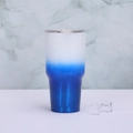 Close-up of a 30oz gradient blue insulated tumbler with ice cubes on marble background - 30oz / White Dark Blue