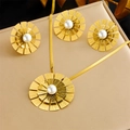 Gold plated flower necklace and earrings set with central white pearls on textured surface - N3091 E6168 R491