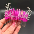 Pink crystal quartz hair comb with silver branch accents held by a hand - Rose Red + Branch