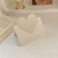 Beige heart-shaped metal card holder with Best Wishes message in a lifestyle setting - Morandi Green
