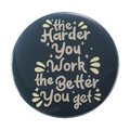 Blue tinplate badge featuring the quote the Harder You Work the Better You get - the Harder You Work