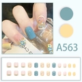 Detail view of A563 blue and yellow floral press-on nails set with 24 short square pieces - Fresh Daisy Blue and Yellow Polka Dot Style (A563)