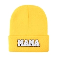 Detailed close-up of bright yellow knit beanie with white MAMA chenille embroidery patch - Yellow