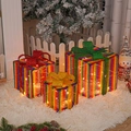 Three glowing rainbow gift boxes with festive bows and warm LED lights for Christmas decor - Rainbow Christmas Gift Box