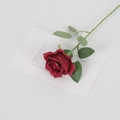 Lifelike single dark red velvet artificial rose with green leaves on white background - Silk Wine Red