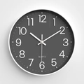 Minimalist round wall clock featuring dark grey dial with white frame and numeric scale - Gray