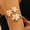 Polished golden floral upper arm cuff bracelet featuring textured flower designs for women - Gold Flower Upper Arm Cuff