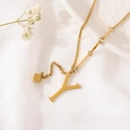 Golden titanium steel necklace featuring a tassel Y-letter pendant on white cloth - Gold Initial Y (8847)