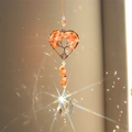 Detail of tree of life heart crystal suncatcher with copper wire and orange stones - Red Agate Heart