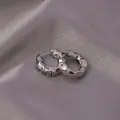 Silver liquid metal hoop earrings with irregular texture on grey satin background - E-054---Platinum