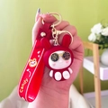 Simpatico portachiavi a coniglio rosso con occhiali e cinturino in silicone Candy - Stile Fortunato