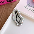 Detail of silver wavy hair clip with multi-colored enamel dots on white ceramic tray - Cloud Silver Colorful Dots