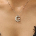 Close-up of star and moon pendant necklace with sparkling crystals on a female model - Silver Moon Star Rhinestone Style (A-1284)