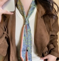 Gray-green paisley silk scarf necklace styled with a white knit top and brown coat - Brown Green Color Block Silk Scarf