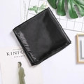 Solid black square satin silk scarf with glossy finish on a minimalist modern background - Black