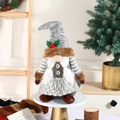 Gray Christmas gnome doll with white braids and holly leaf detail on a wooden stand - Grey Large Female Style / 35x13cm / 0.0
