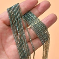 Macro shot of dark green faceted 2mm crystal glass beads for DIY jewelry making - 1 Strand Approx. 200 Pieces/Pack (2mm) / Iridescent Green