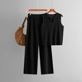 Detailed close-up of summer black knit vest and wide-leg pants set with a stylish handbag - One Size / Black
