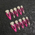 Pink and white stiletto press-on nails with black corset lacing on a stone background - Extra Small (XS) / Pink & White Bandage Style