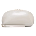 Cream shell-shaped faux leather makeup bag with gold zipper and wrist strap in studio shot - White