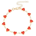 Detailed close-up of a gold heart bracelet featuring vibrant red gemstones and lobster clasp - Heart / KC Gold Red