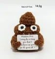 Handmade brown knit poop doll with smiley face holding a positive card for desk decor - Poop Brown