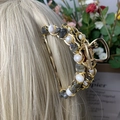 Golden hair claw clip with white pearls and grey natural stone chips on blonde hair - Labradorite + Deep Sea Pearl Gold Hair Claw