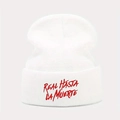 White knit beanie featuring red Real Hasta La Muerte embroidery in a classic cuffed style - White with Red Letters