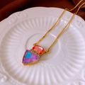 Detail of vintage gold necklace with orange and blue gradient gems on ceramic tray - 25# Necklace-Gold Red Purple Gradient Triangle Pendant Style