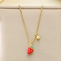 Detailed view of a sweet gold strawberry pendant necklace with red enamel and white dots - Double Pendant Red Strawberry Gold Bead (KN292058-Z)
