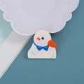 Cute white acrylic duck pin with a blue bow and orange beak on a blue background - Penguin Duck