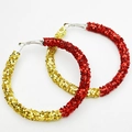 Detailed view of red and gold glitter hoop earrings featuring a shiny sequin finish - Red and Gold