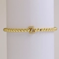 Golden bead stretch bracelet with zircon-encrusted letter Z pendant in minimalist style - Letter Z
